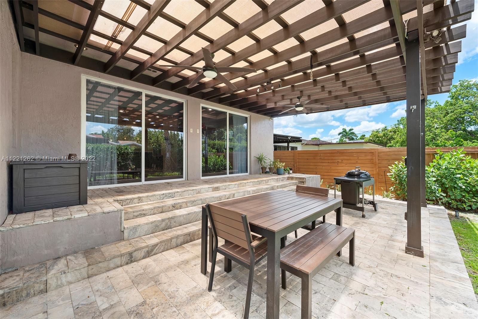 2321 Southwest 19th Street Miami, FL 33145 - Photo 23 of 29 a view of a patio with a table chairs and a backyard