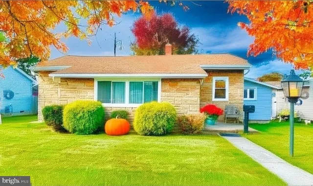 a front view of house with an outdoor space and seating area