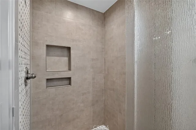 a bathroom with a shower and a sink