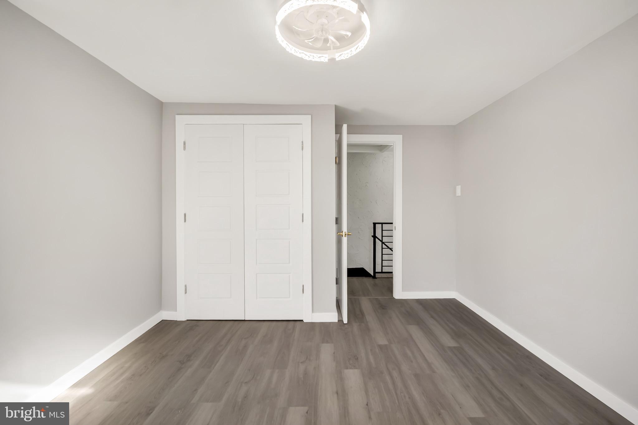 246 Cottage Avenue, Unit B Horsham, PA 19044 - Photo 14 of 19 an empty room with wooden floor and windows
