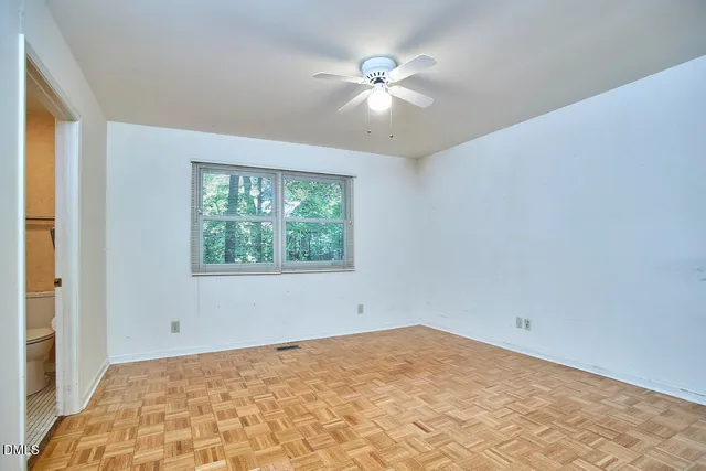 a view of a room with a large window