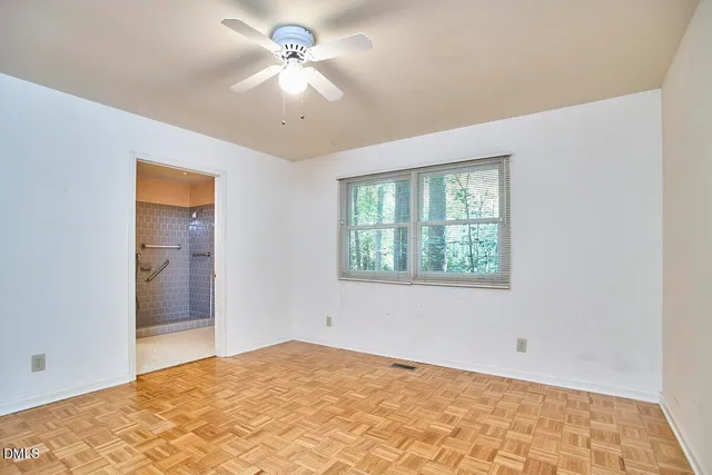 a view of an empty room with a window