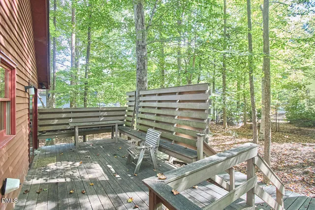 a view of a bench in a back yard