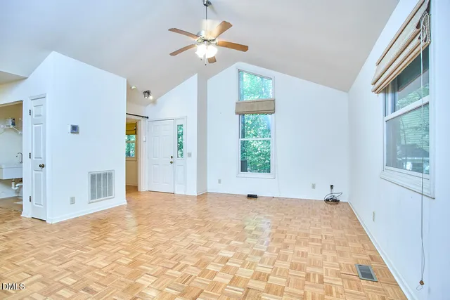 a view of an empty room with a window