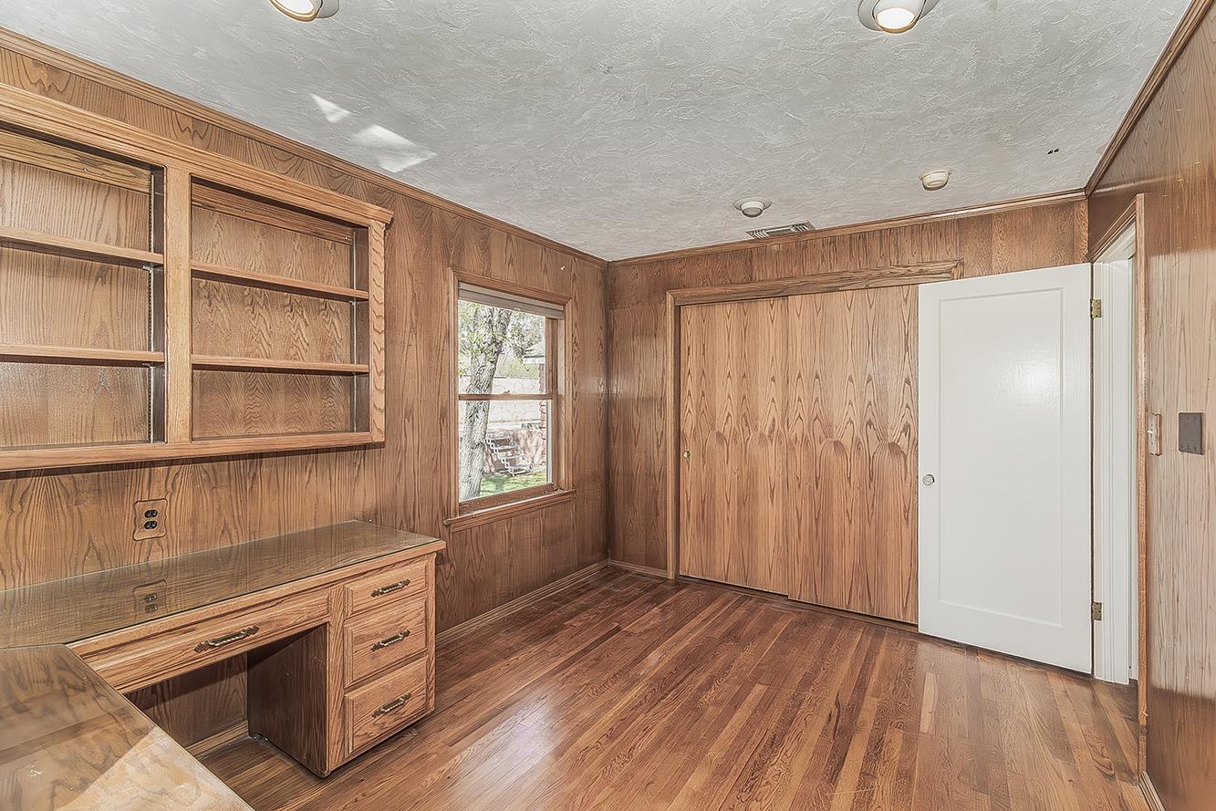 31638 Lodge Road Auberry, CA 93602 - Photo 27 of 90 a view of an empty room with a window and wooden floor