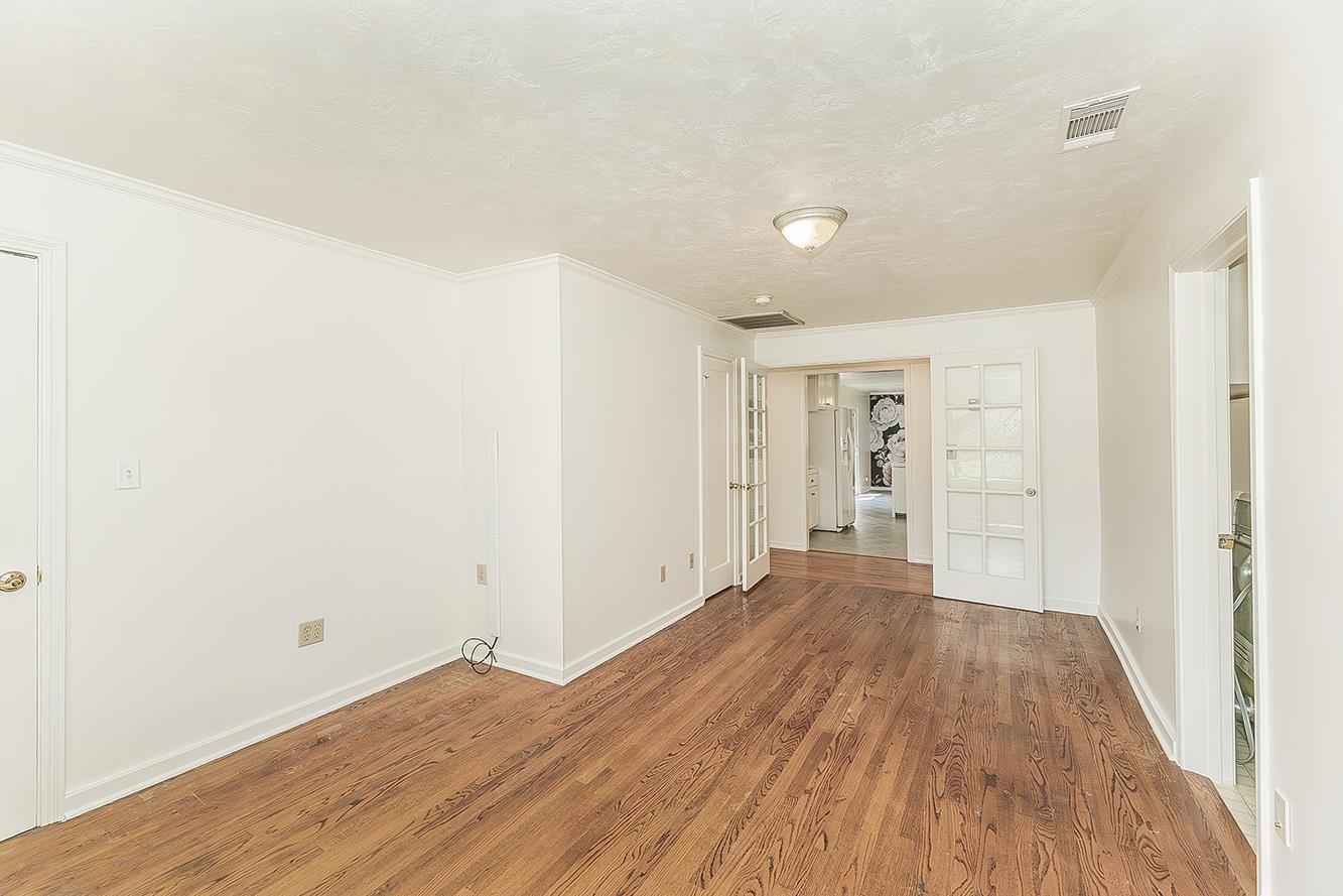 31638 Lodge Road Auberry, CA 93602 - Photo 33 of 90 a view of a big room with wooden floor and windows
