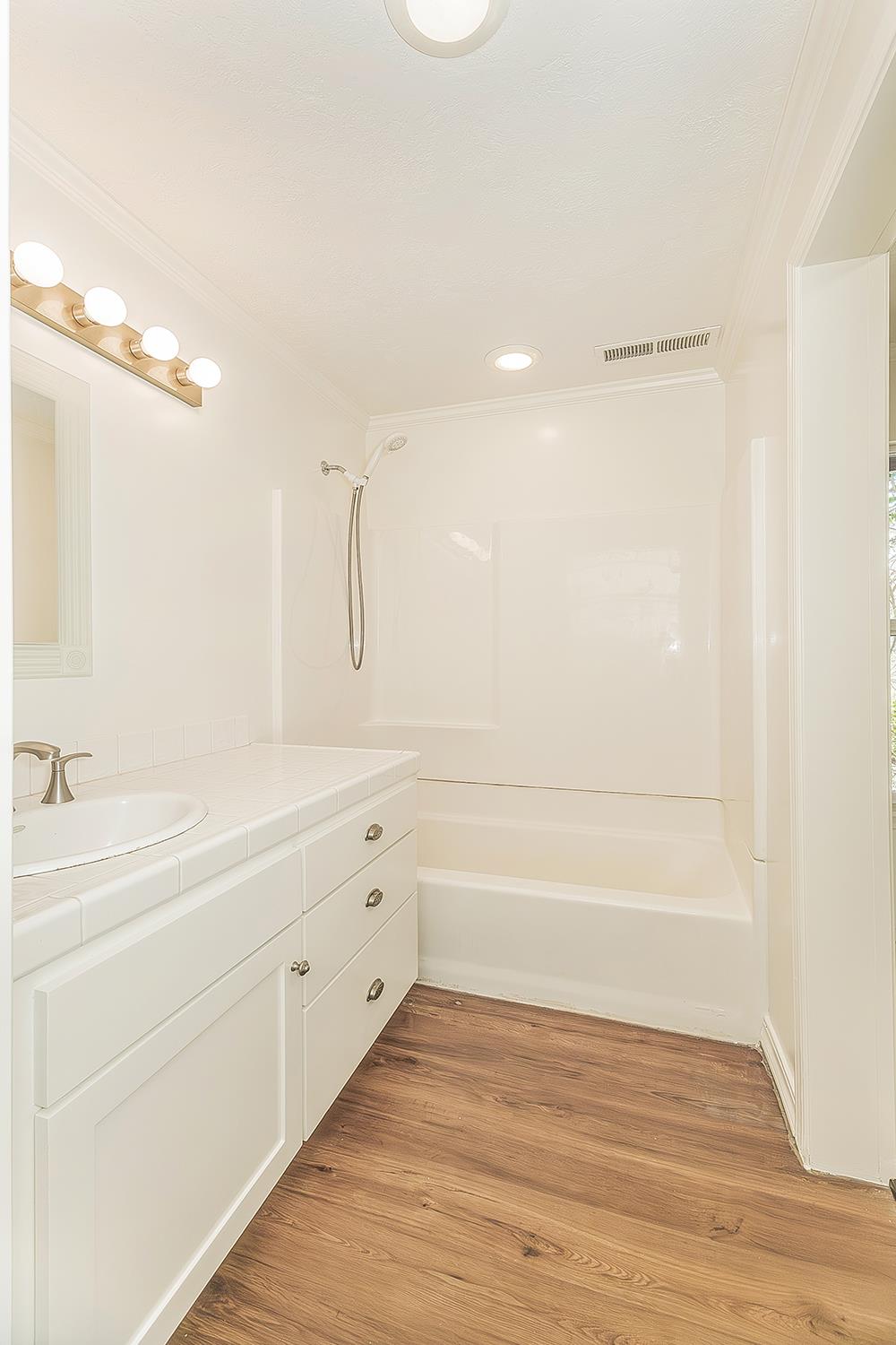 31638 Lodge Road Auberry, CA 93602 - Photo 40 of 90 a bathroom with a bathtub and a sink