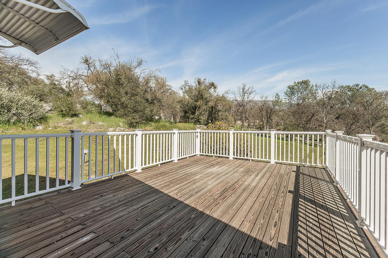 31638 Lodge Road Auberry, CA 93602 - Photo 55 of 90 a balcony with wooden floor and fence