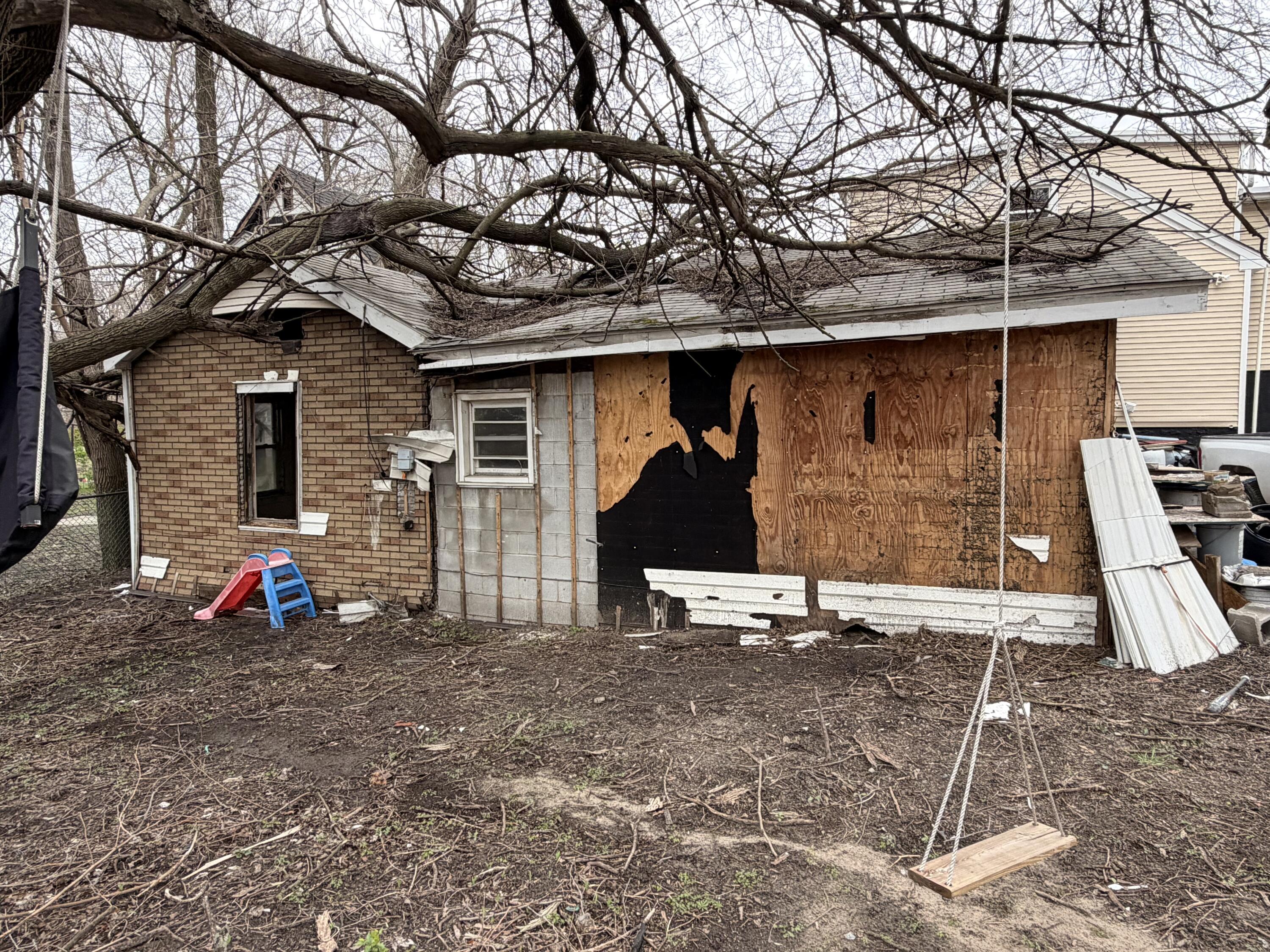 1574 Jennings Street Gary, IN 46404 - Photo 1 of 3 a front view of a house with patio