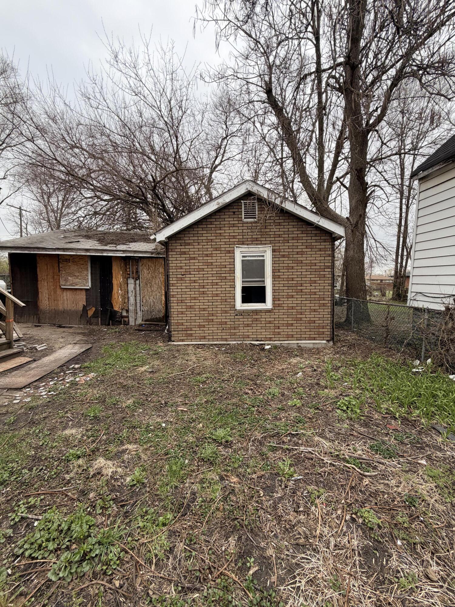 1574 Jennings Street Gary, IN 46404 - Photo 3 of 3 a front view of a house with a yard