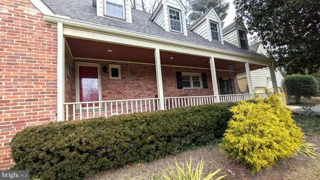 a view of a house with a flower garden
