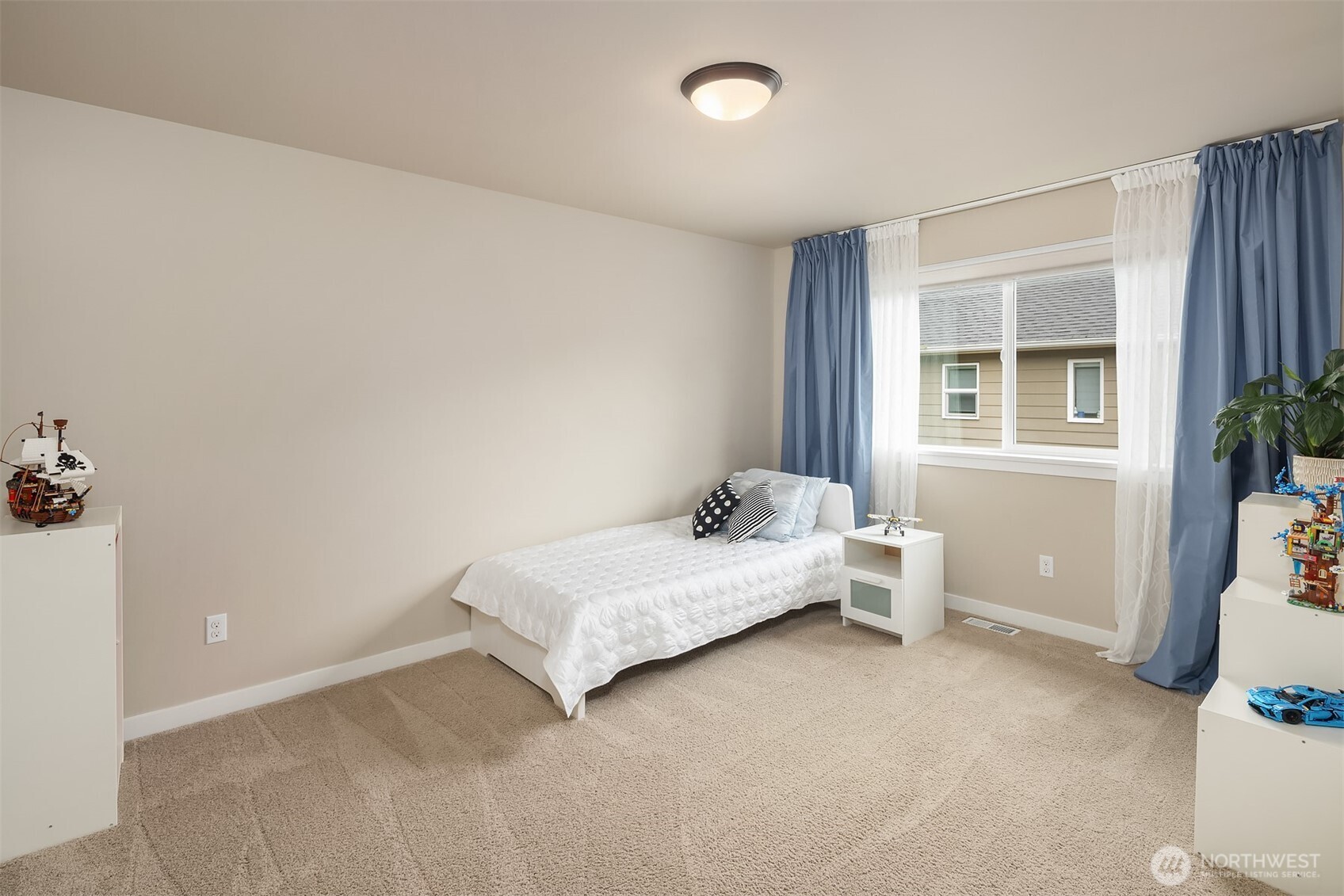 1435 242nd Place Southeast Bothell, WA 98021 - Photo 32 of 40 a bedroom with a bed and a window