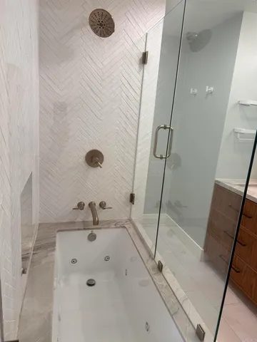 a bathroom with a sink and a shower