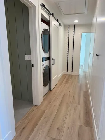 a view of a storage and utility room with washer and dryer