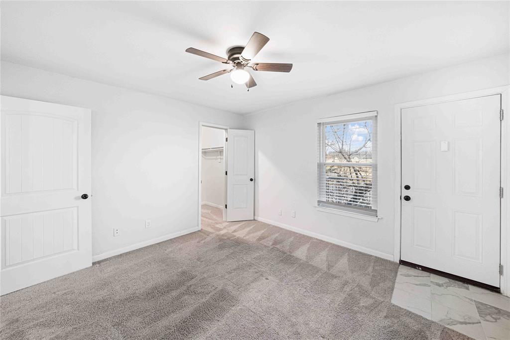 2200 East Trinity Mills Road, Unit 510 Carrollton, TX 75006 - Photo 10 of 17 a view of an empty room with a window
