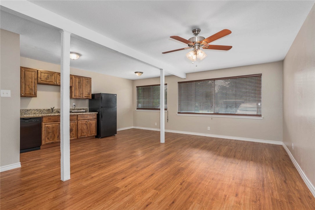 3914 Old College Road Bryan, TX 77801 - Photo 6 of 12 a view of an empty room with window and wooden floor
