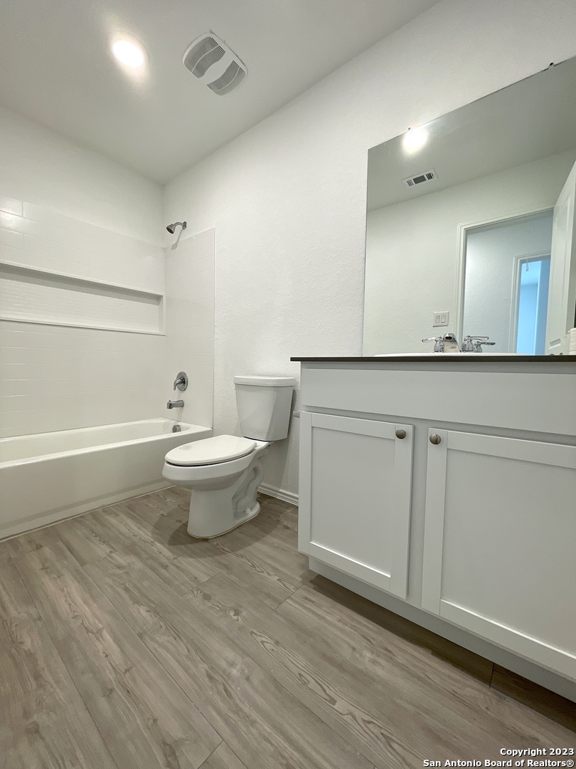 7274 Pasture Run San Antonio, TX 78252 - Photo 11 of 17 a bathroom with a sink and a toilet