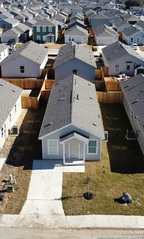 a aerial view of a house with a yard