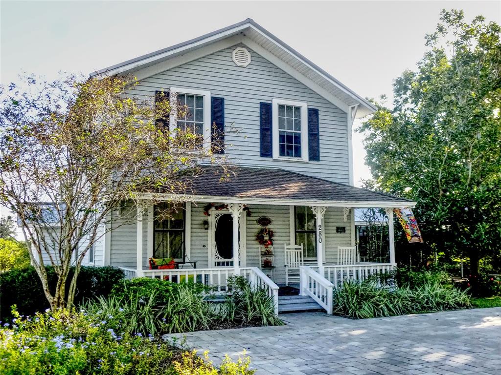 280 Overocker Circle Frostproof, FL 33843 - Photo 1 of 1 a front view of a house with a garden