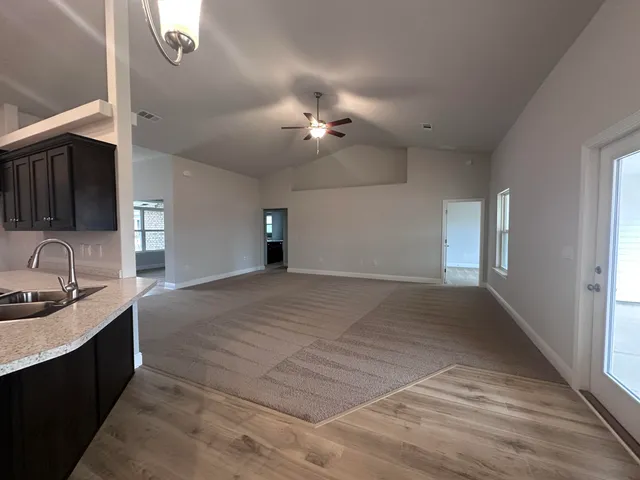 a view of a kitchen with a sink and dishwasher