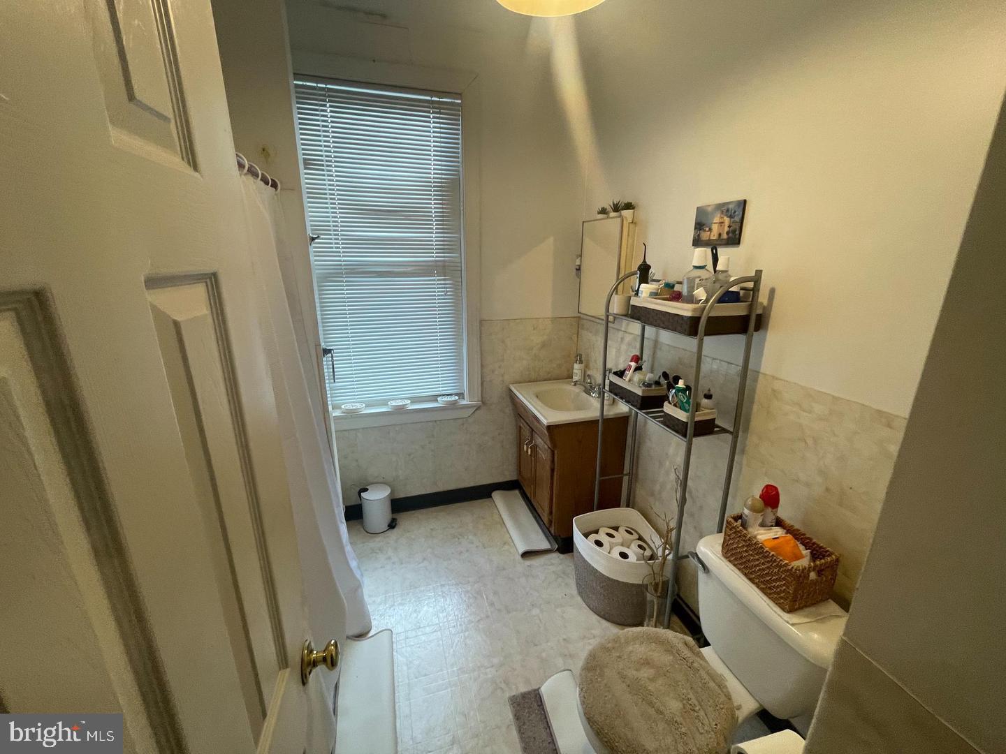 1115 North Calvert Street Baltimore, MD 21202 - Photo 23 of 35 a bathroom with a toilet and a sink