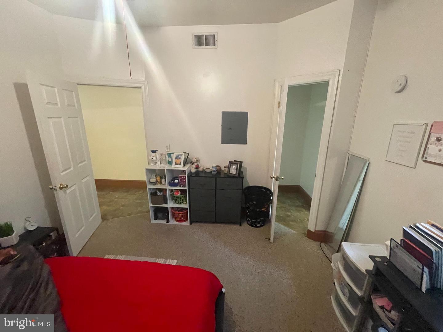 1115 North Calvert Street Baltimore, MD 21202 - Photo 24 of 35 a living room with furniture a fireplace and a flat screen tv