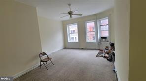 1115 North Calvert Street Baltimore, MD 21202 - Photo 25 of 35 a view of livingroom with furniture and windows