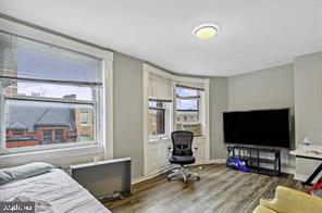 1115 North Calvert Street Baltimore, MD 21202 - Photo 27 of 35 a living room with furniture and a flat screen tv