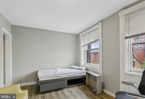 1115 North Calvert Street Baltimore, MD 21202 - Photo 28 of 35 a room with a bed and a window