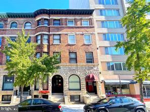 1115 North Calvert Street Baltimore, MD 21202 - Photo 3 of 35 a couple of table and chairs in front of building