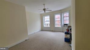 1115 North Calvert Street Baltimore, MD 21202 - Photo 34 of 35 an empty room with windows and closet