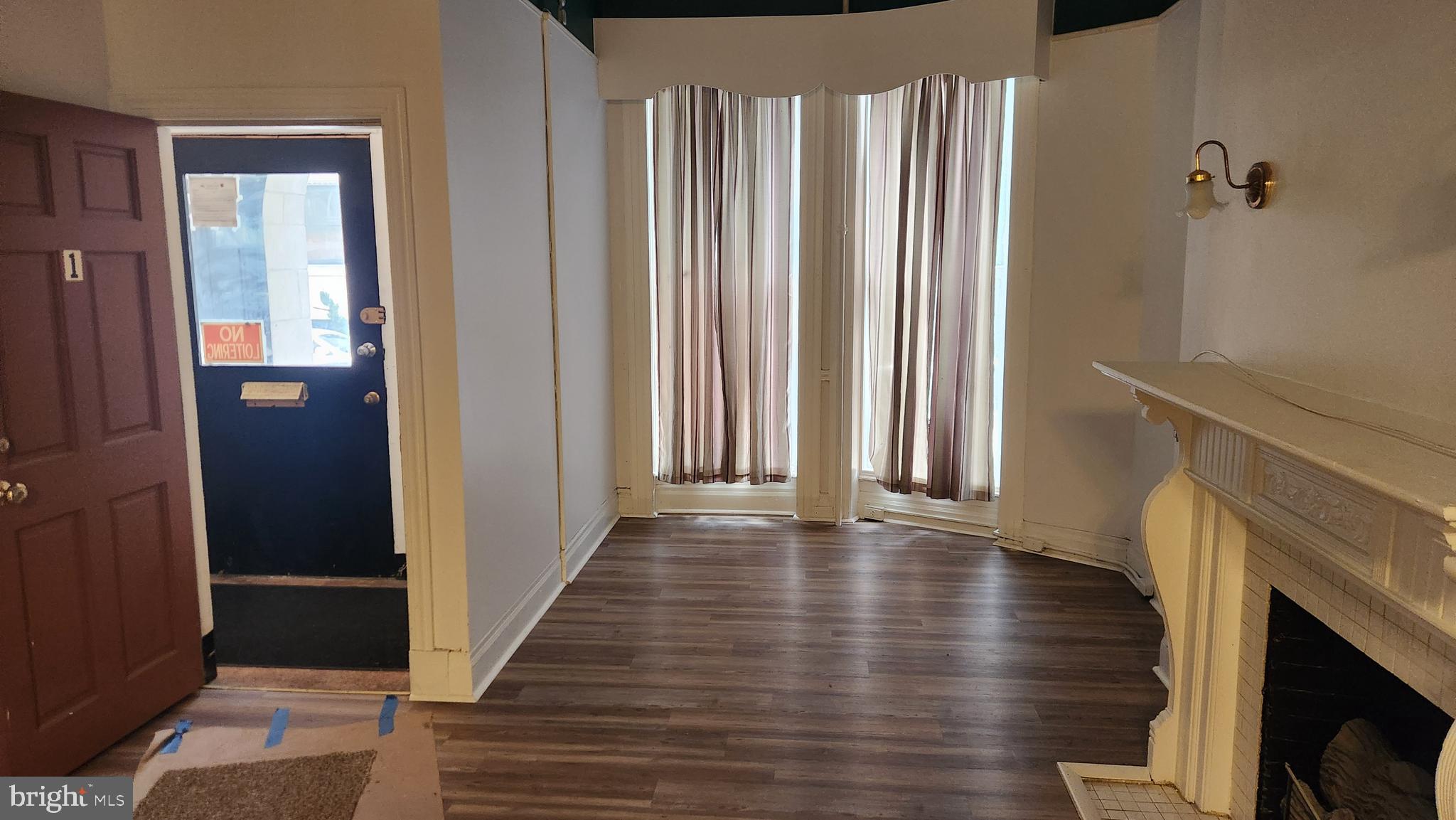 1115 North Calvert Street Baltimore, MD 21202 - Photo 4 of 35 a view of an entryway with wooden floor