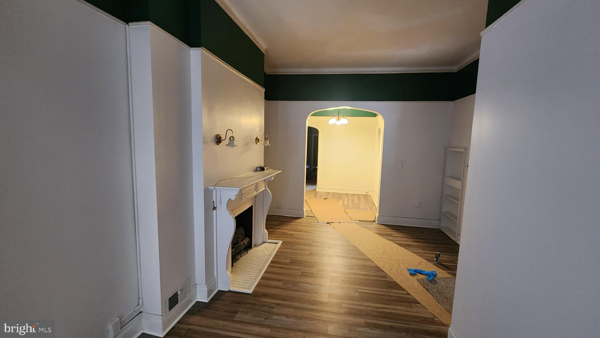 1115 North Calvert Street Baltimore, MD 21202 - Photo 5 of 35 a view of a hallway with wooden floor and staircase