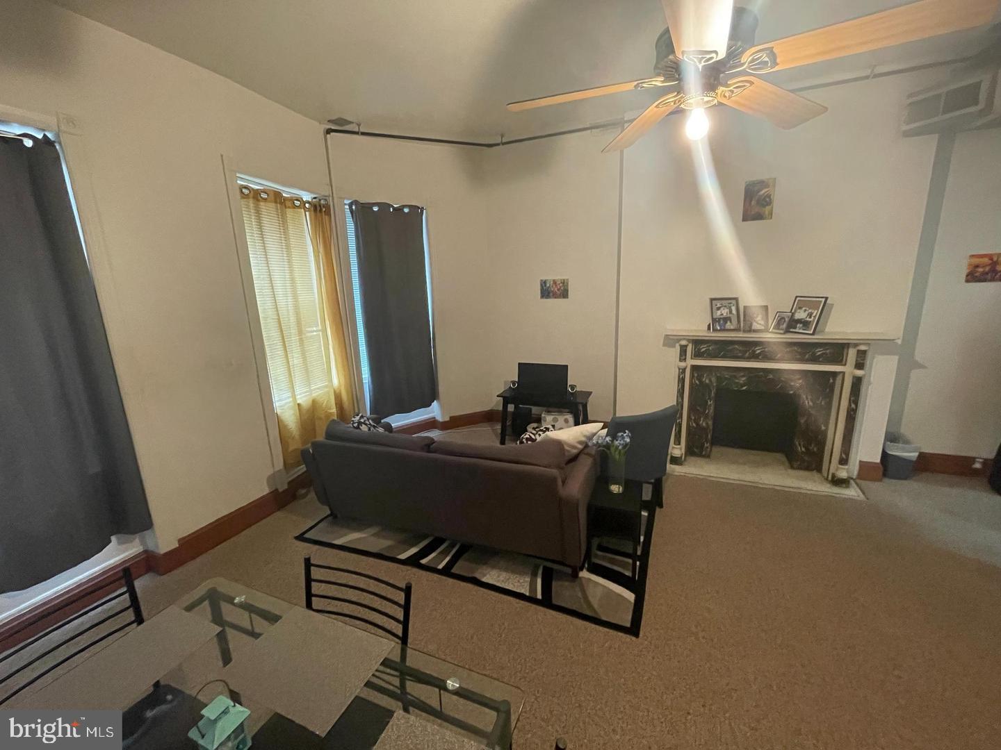 1115 North Calvert Street Baltimore, MD 21202 - Photo 10 of 35 view of living room with furniture and a fireplace