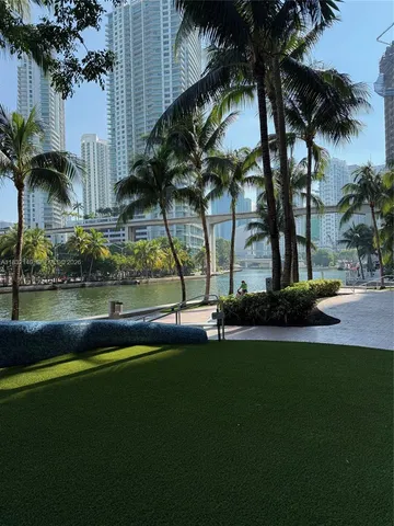 a view of swimming pool with a yard and lake view