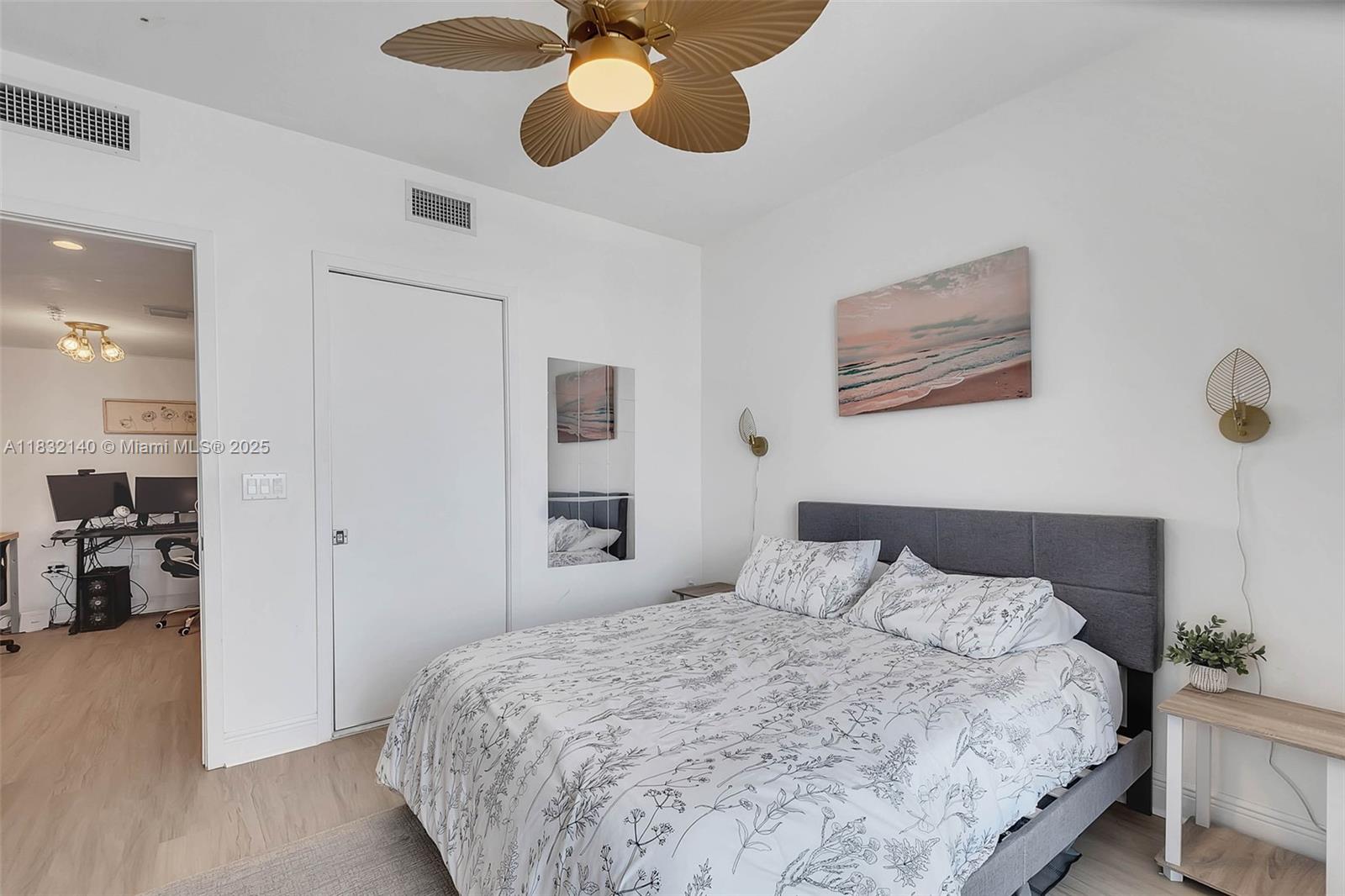 185 Southwest 7th Street, Unit 2204 Miami, FL 33130 - Photo 8 of 21 a bedroom with a bed and painting on the wall