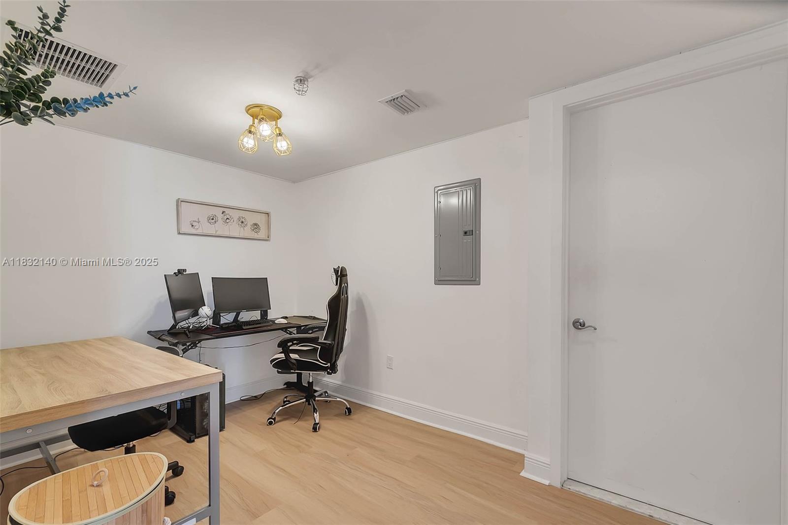 185 Southwest 7th Street, Unit 2204 Miami, FL 33130 - Photo 9 of 21 a view of a workspace with furniture and a window