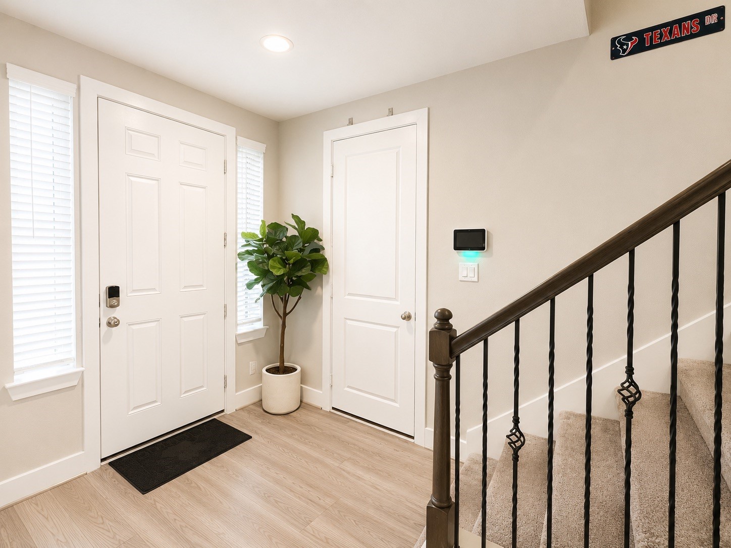 731 Janisch Road Houston, TX 77018 - Photo 3 of 19 Foyer with angle of front door and 2 car garage access with Tesla car charger.