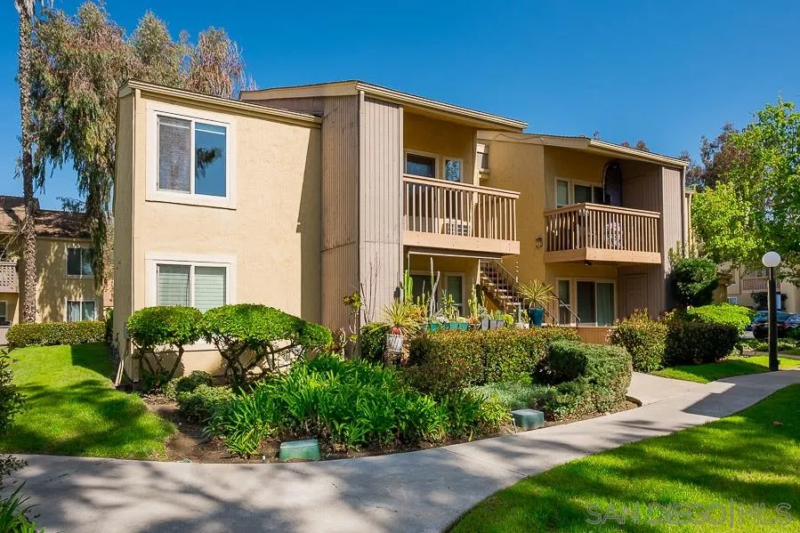6046 Rancho Mission Road, Unit 384 San Diego, CA 92108 - Photo 1 of 18 a front view of a house with a yard