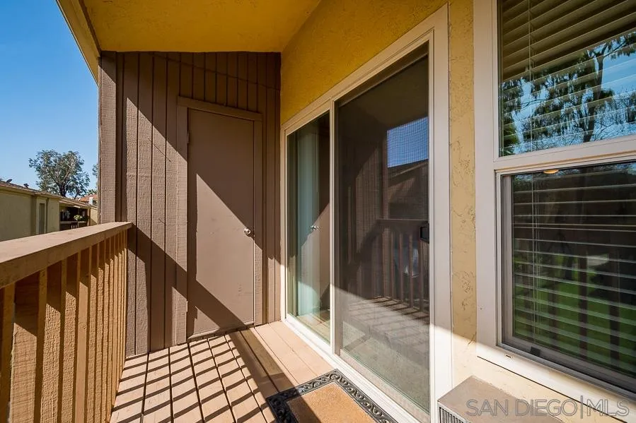 6046 Rancho Mission Road, Unit 384 San Diego, CA 92108 - Photo 14 of 18 a view of balcony with wooden floor and stairs