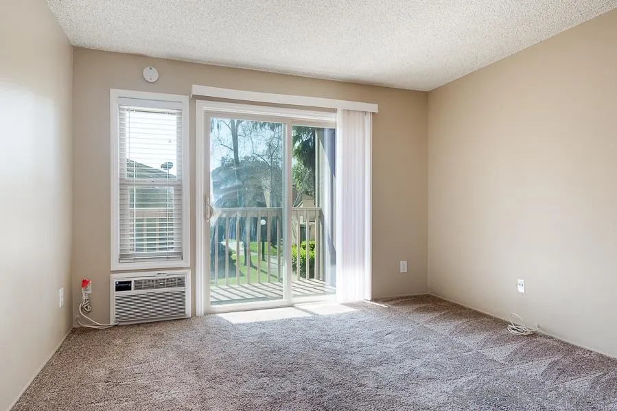6046 Rancho Mission Road, Unit 384 San Diego, CA 92108 - Photo 3 of 18 an empty room with windows