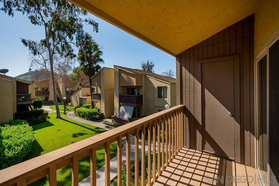 6046 Rancho Mission Road, Unit 384 San Diego, CA 92108 - Photo 4 of 18 a view of a house with backyard
