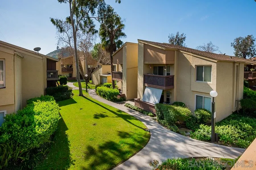 6046 Rancho Mission Road, Unit 384 San Diego, CA 92108 - Photo 5 of 18 a view of a house with a swimming pool