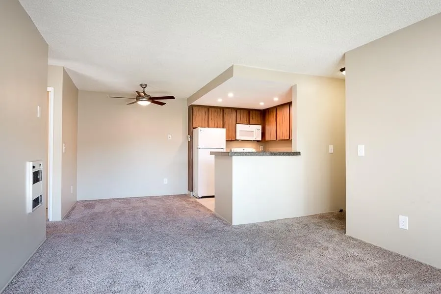 6046 Rancho Mission Road, Unit 384 San Diego, CA 92108 - Photo 6 of 18 an empty room with a window