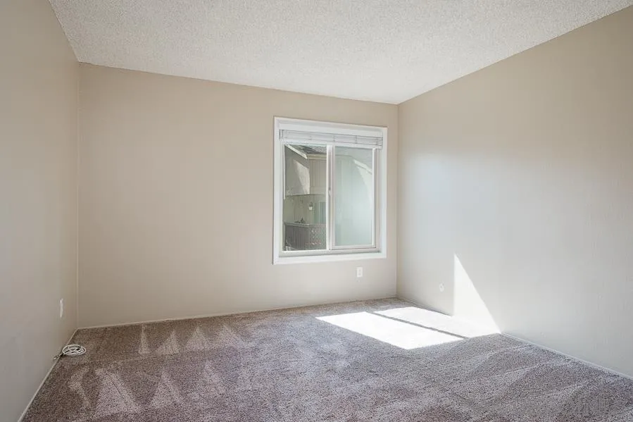 6046 Rancho Mission Road, Unit 384 San Diego, CA 92108 - Photo 10 of 18 a view of an empty room with a window