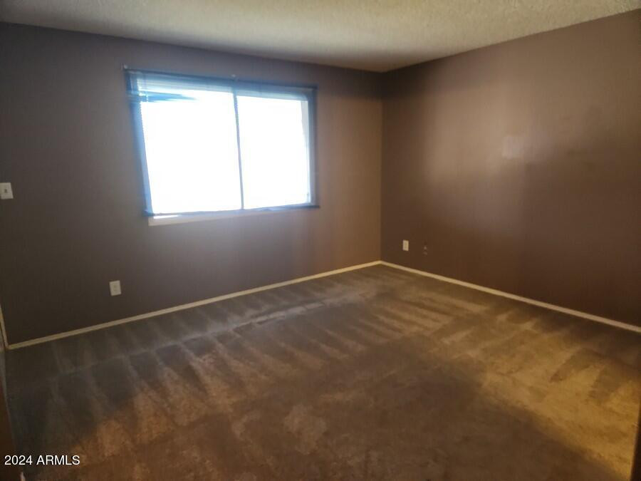 4330 West Royal Palm Road Glendale, AZ 85302 - Photo 15 of 21 an empty room with a window