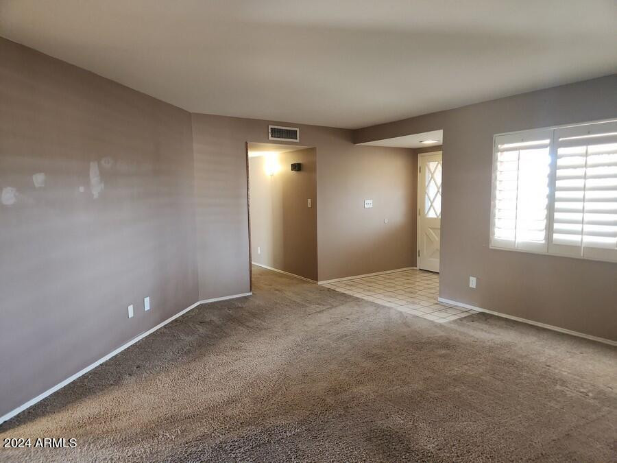 4330 West Royal Palm Road Glendale, AZ 85302 - Photo 8 of 21 a view of an empty room with window and bathroom