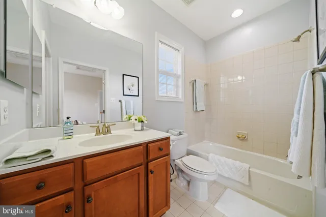 a bedroom with a bed and glass windows