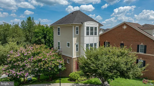 an aerial view of a house with a lake view