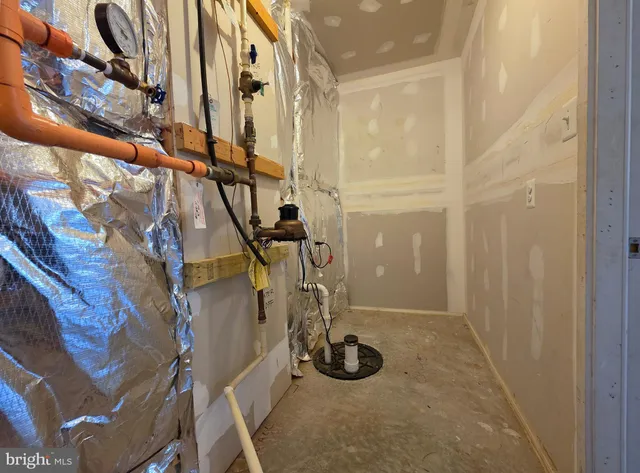 an aerial view of a house with a garden and lake view